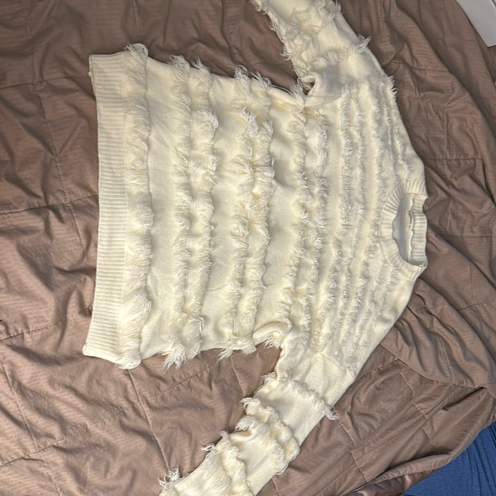 Lost weight and just a little big, beautiful cream colored sweater.